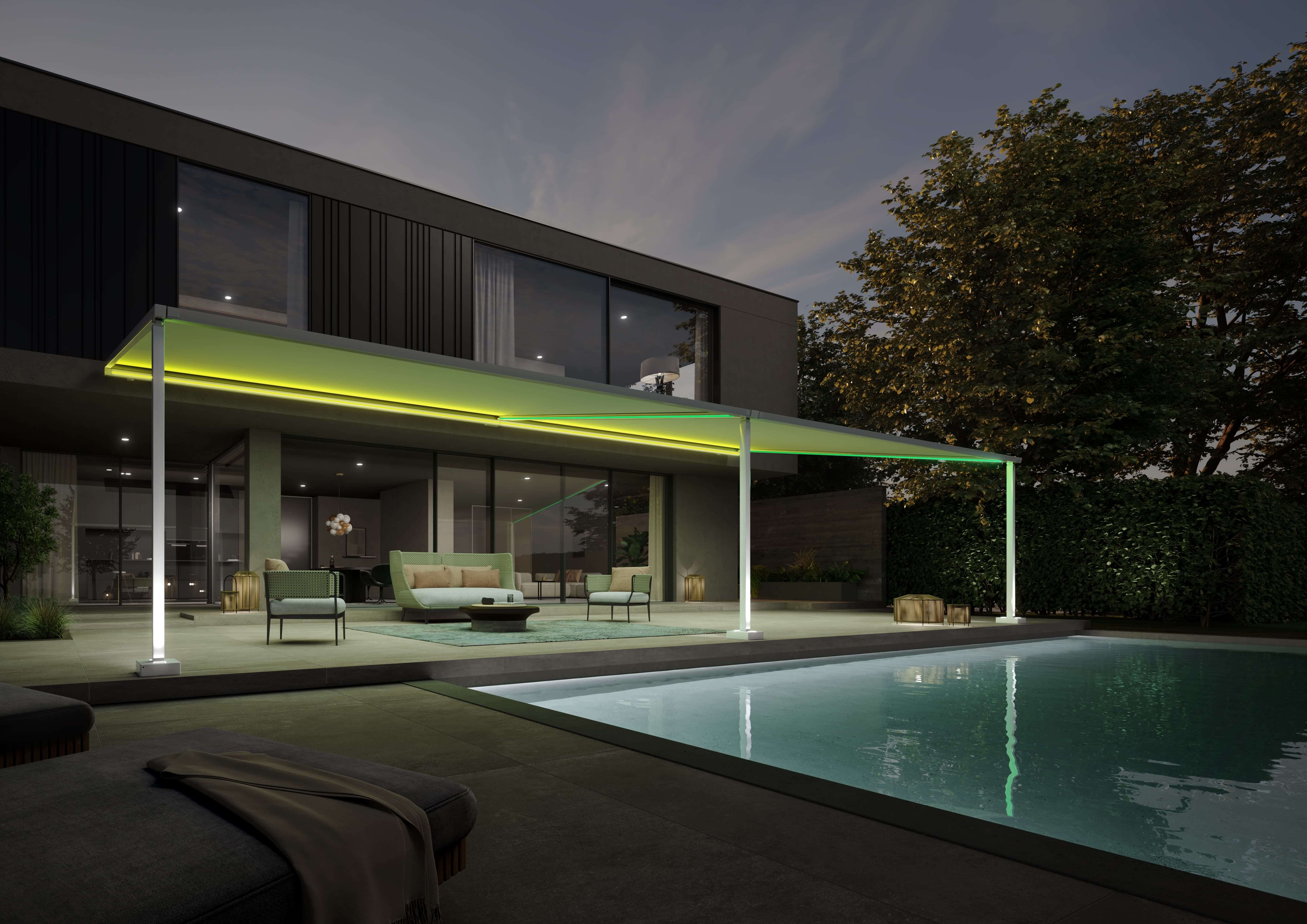 Pergola Markise mit LED Beleuchtung in mehreren Farben. Die LB Beleuchtung beleuchtet die Terrasse und den Pool.